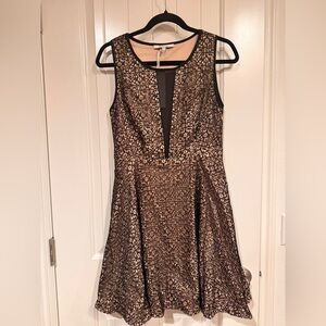 Lucy Paris Black and nude Mini Dress sold at Revolve.size M NWT